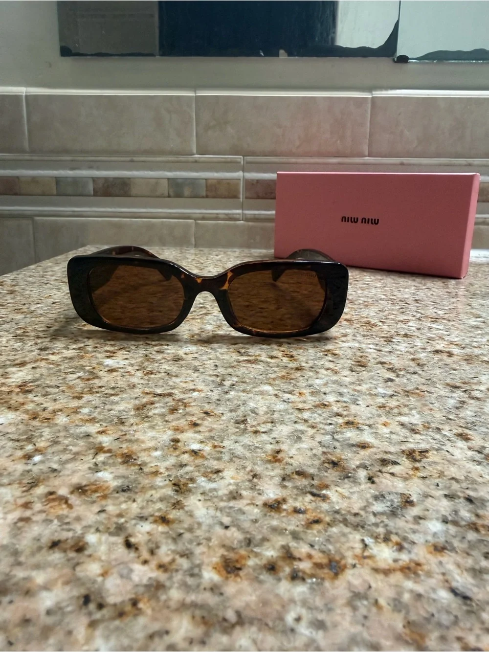 Miu Miu Tortoiseshell Sunglasses with Gold Temple Logo and Brown Lenses